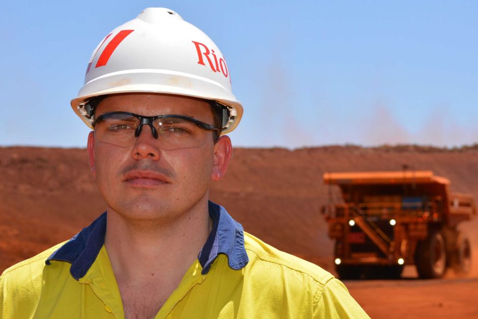 Driverless trucks move all iron ore at Rio Tinto's Pilbara mines, in world first